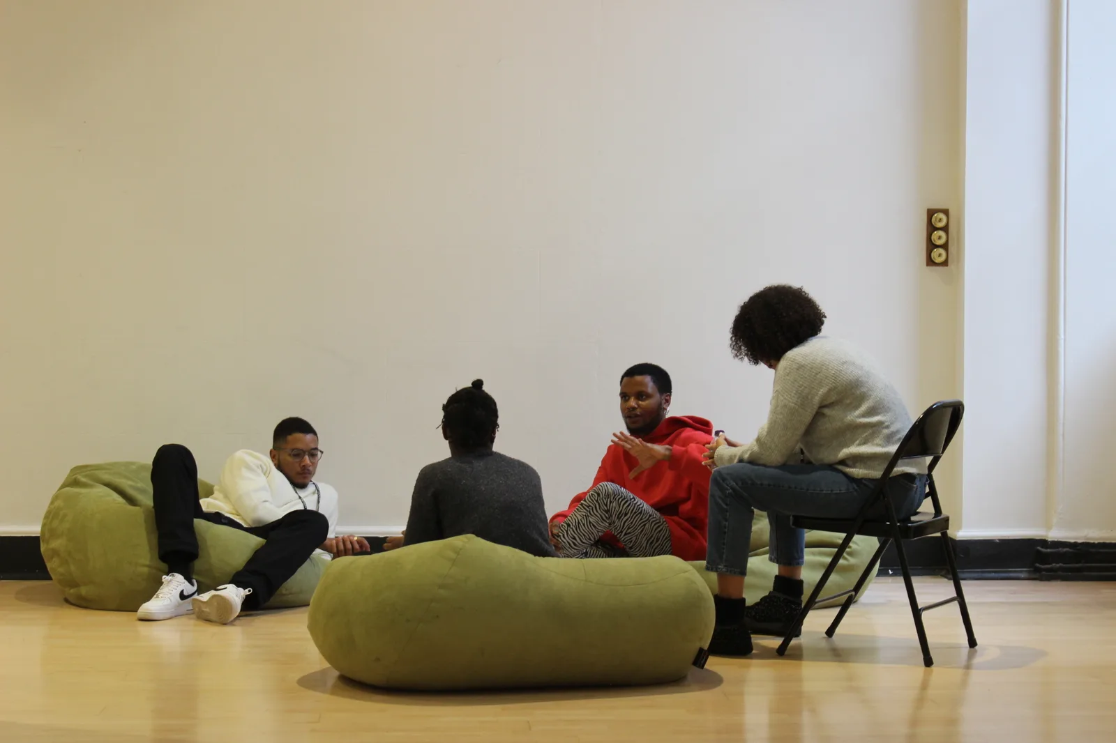 A co-design session in progress, Young Producers in discussion on beanbags