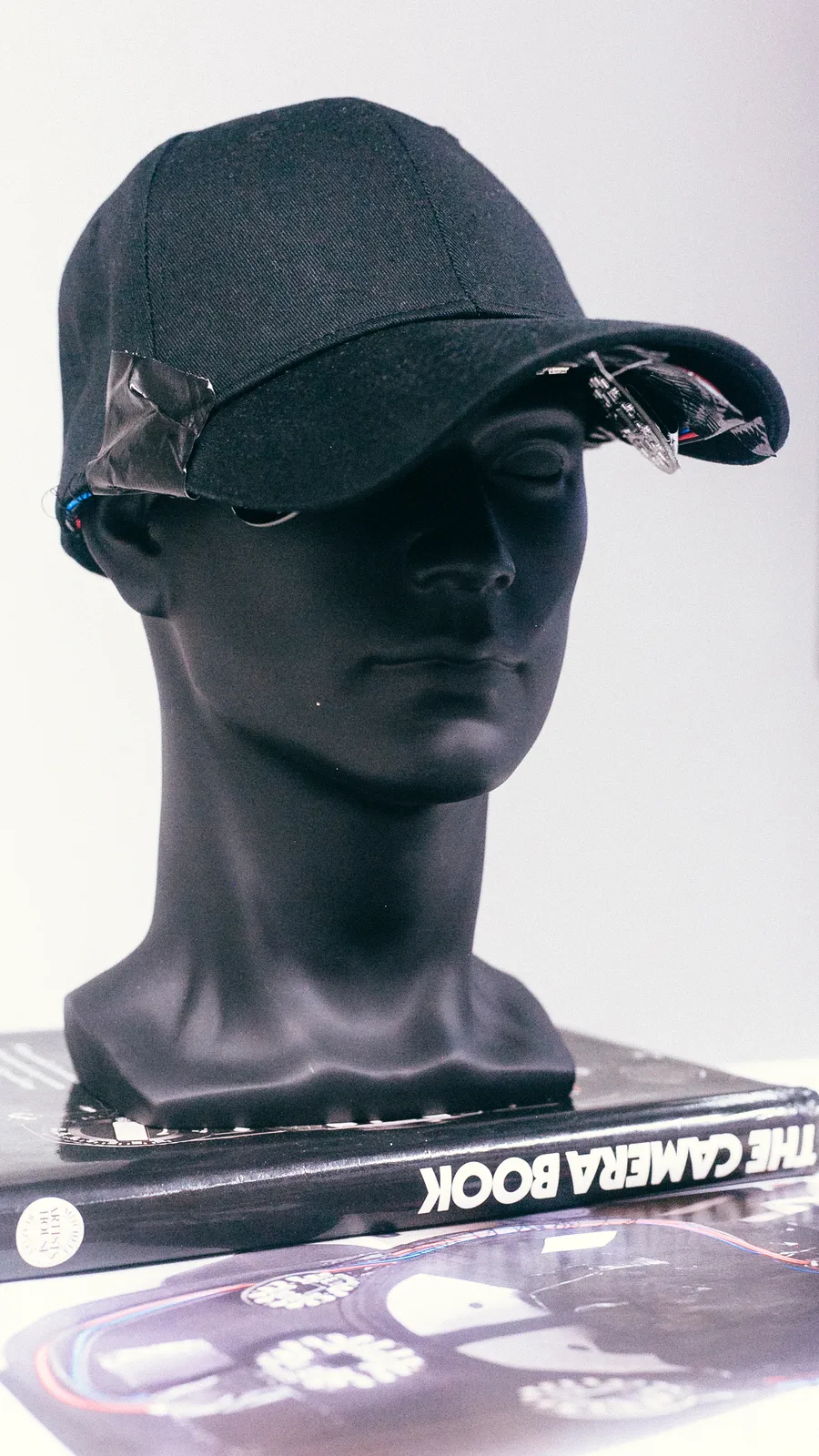 The Invisible Mask prototype, a black cap on a mannequin head with infrared LEDs under the brim