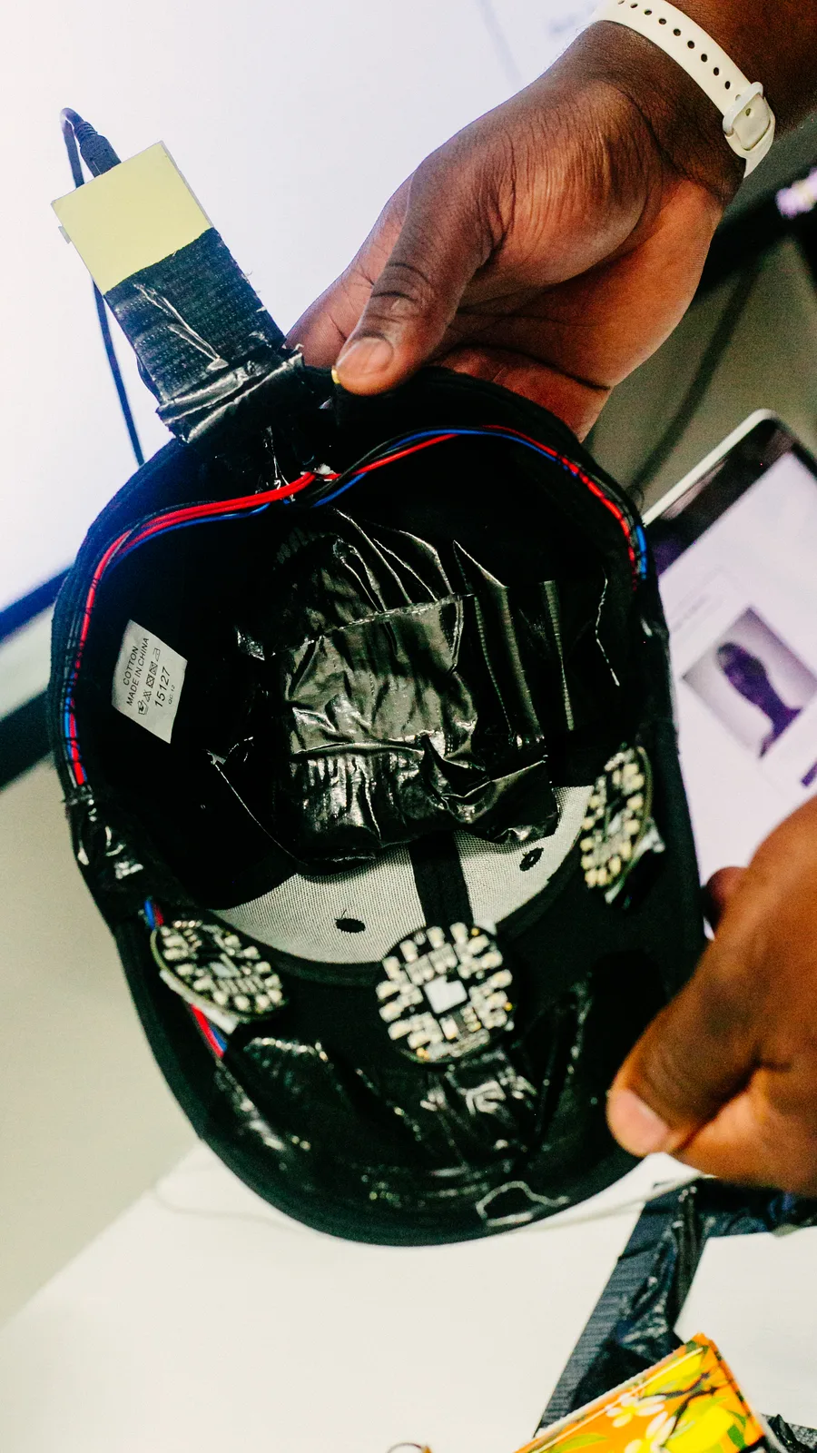 Inside the cap, the infrared LED boards and wiring taped into the lining