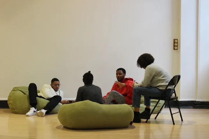 A co-design session in progress, Young Producers in discussion on beanbags